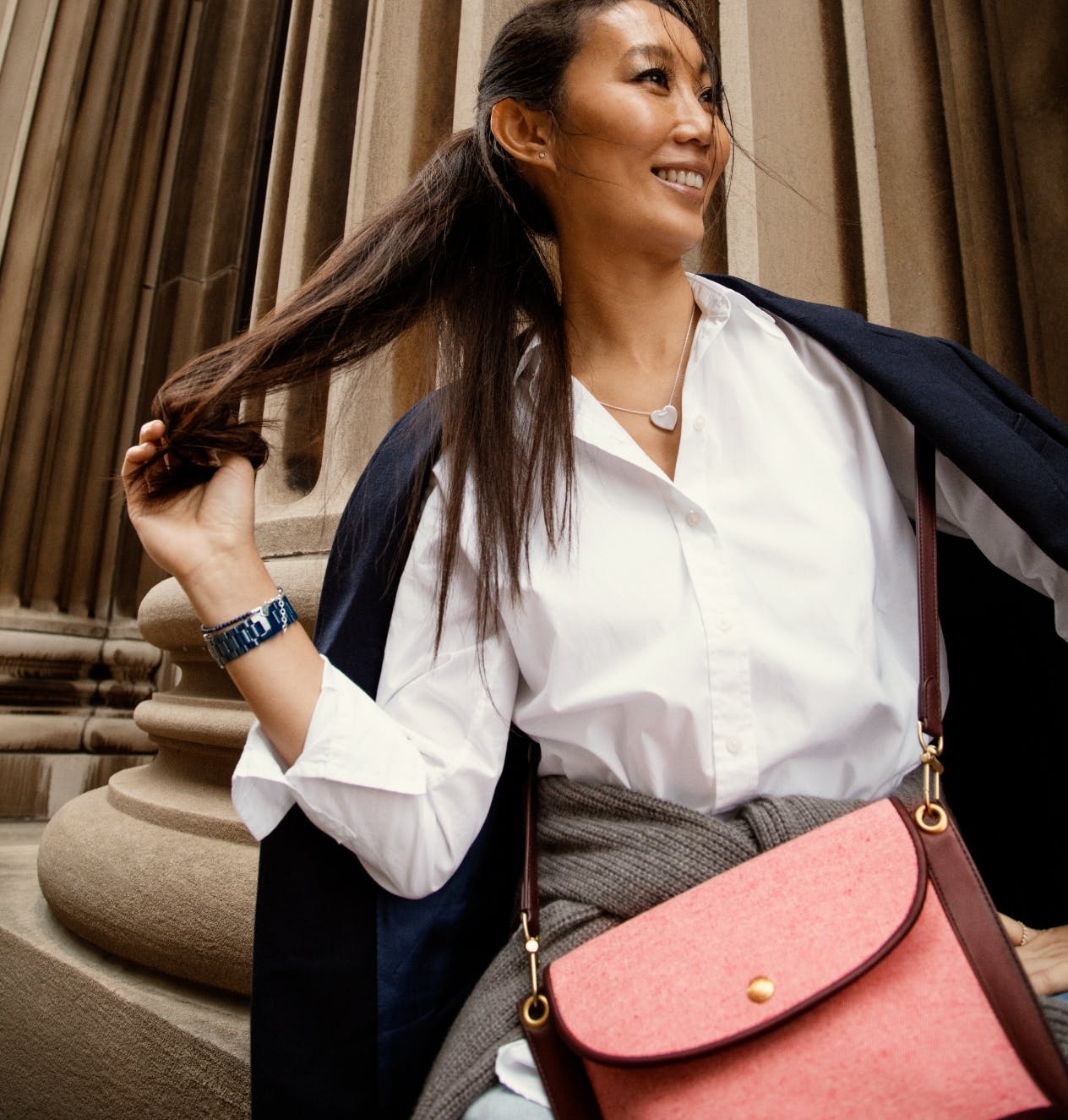Woman wearing a Shinola watch and bag