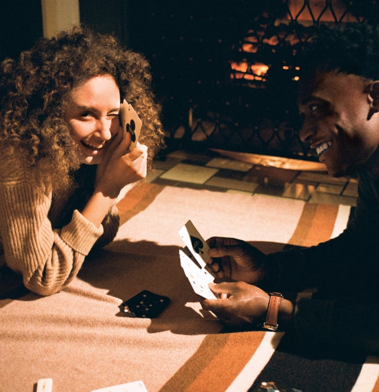 A man and woman playing cards